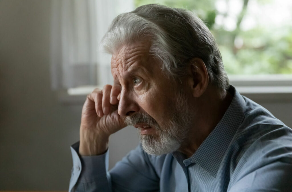 An elderly man rubs his face and eye, feeling irritated due to cataracts. Age-related cataracts: These are the most common type of cataracts and develop due to natural changes in your eyes.