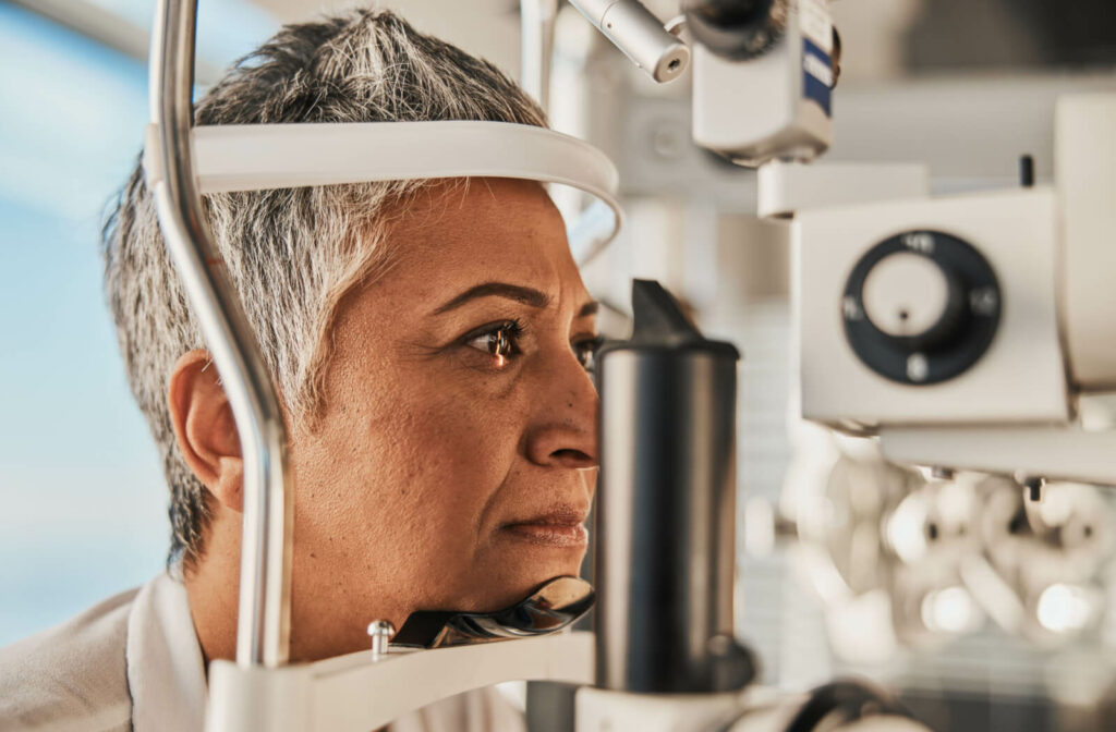 Close-up of a senior woman undergoing a slit-lamp exam.